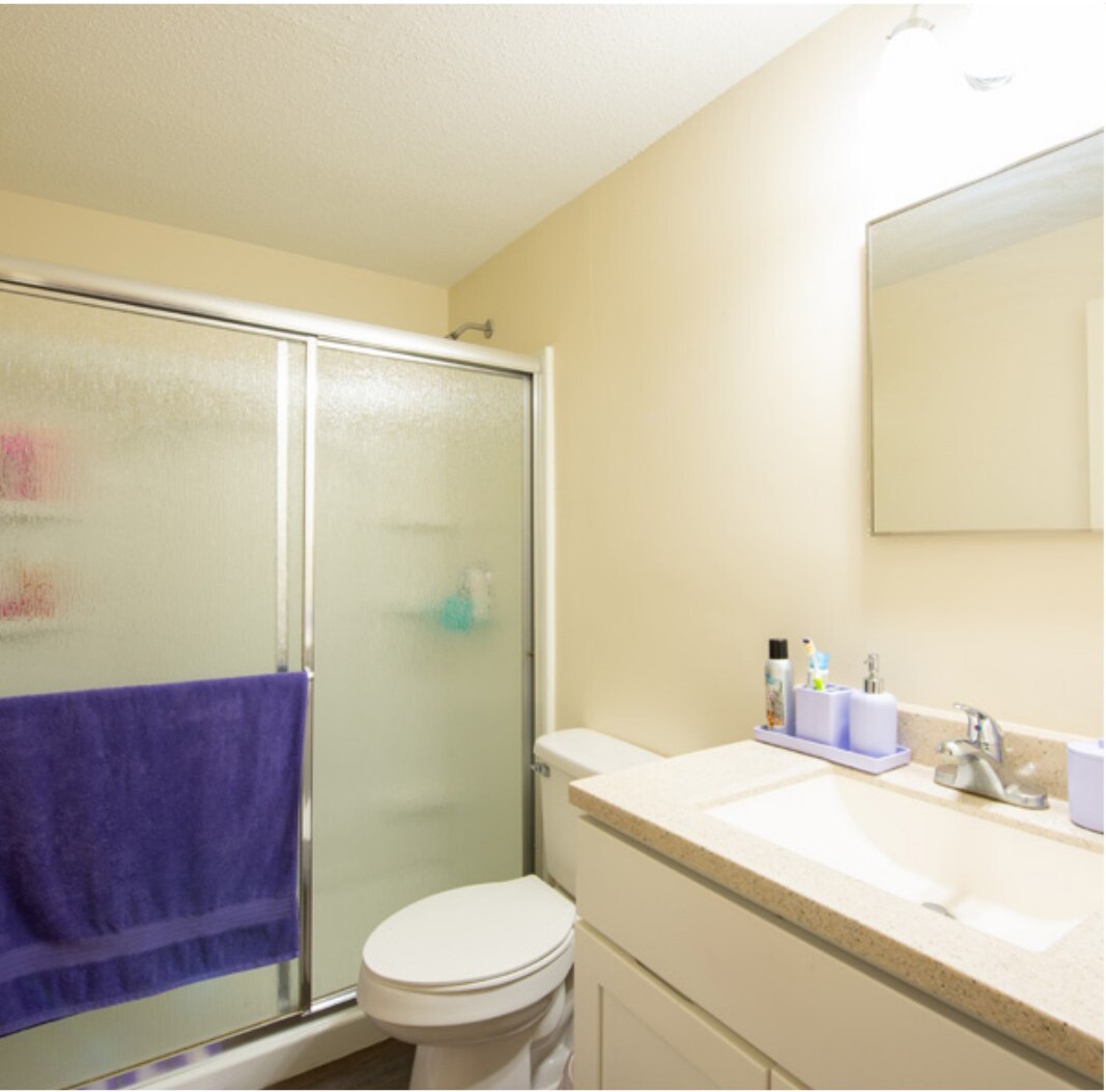 Renovated bathroom with walk-in shower and updated vanity